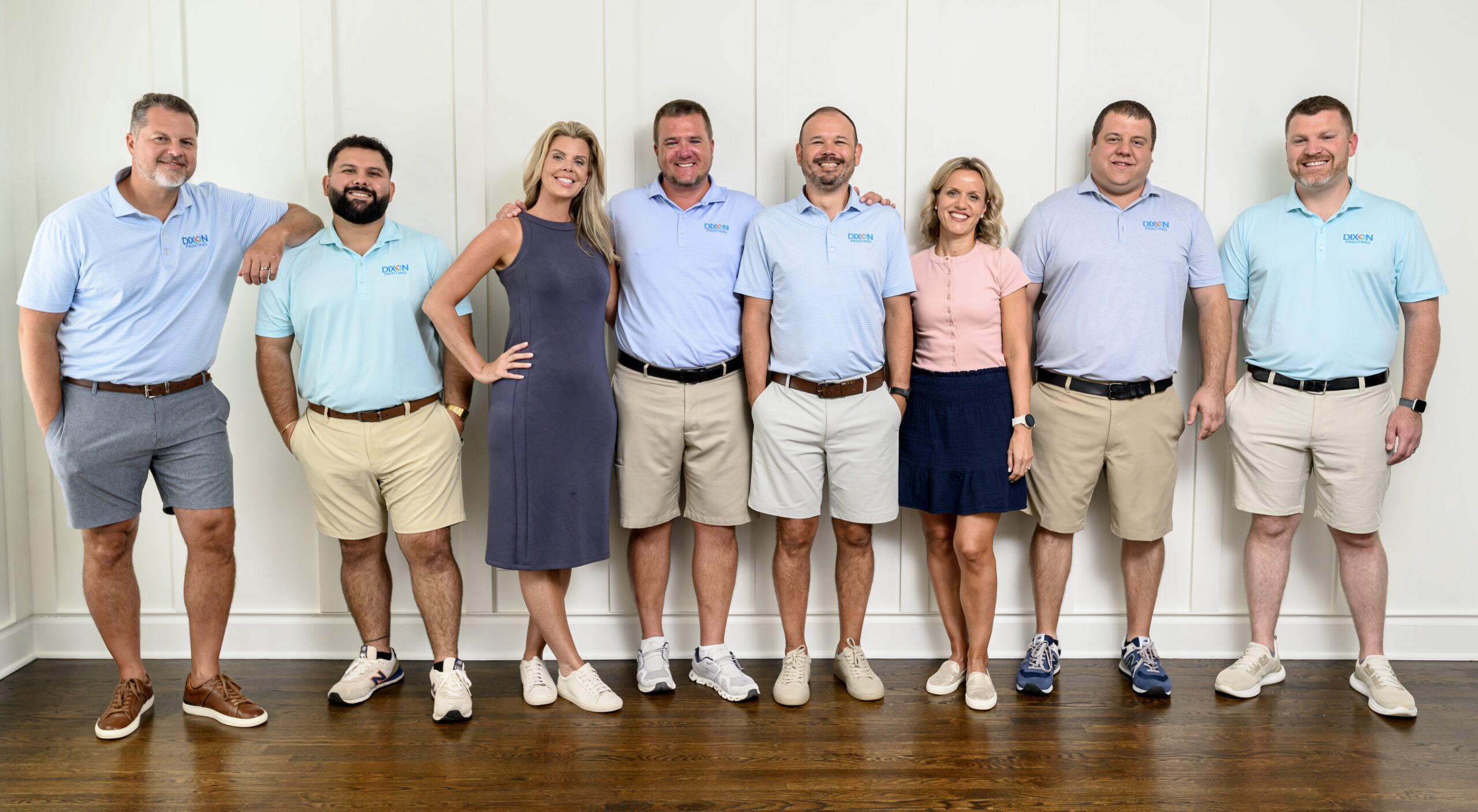 The Dixon family stands on a bridge smiling for a family photo in Atlanta, GA