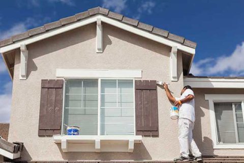 painter painting house exterior