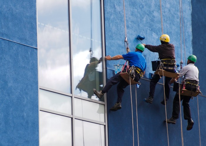 Suspended Painters painting a commercial building in Atlanta, GA
